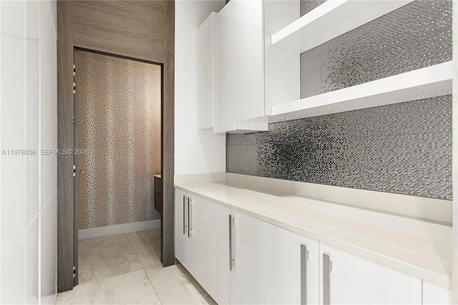 Custom cabinetry and built-in storage area