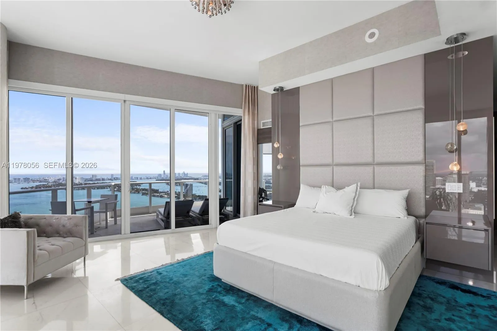 Luxurious primary suite with private balcony access