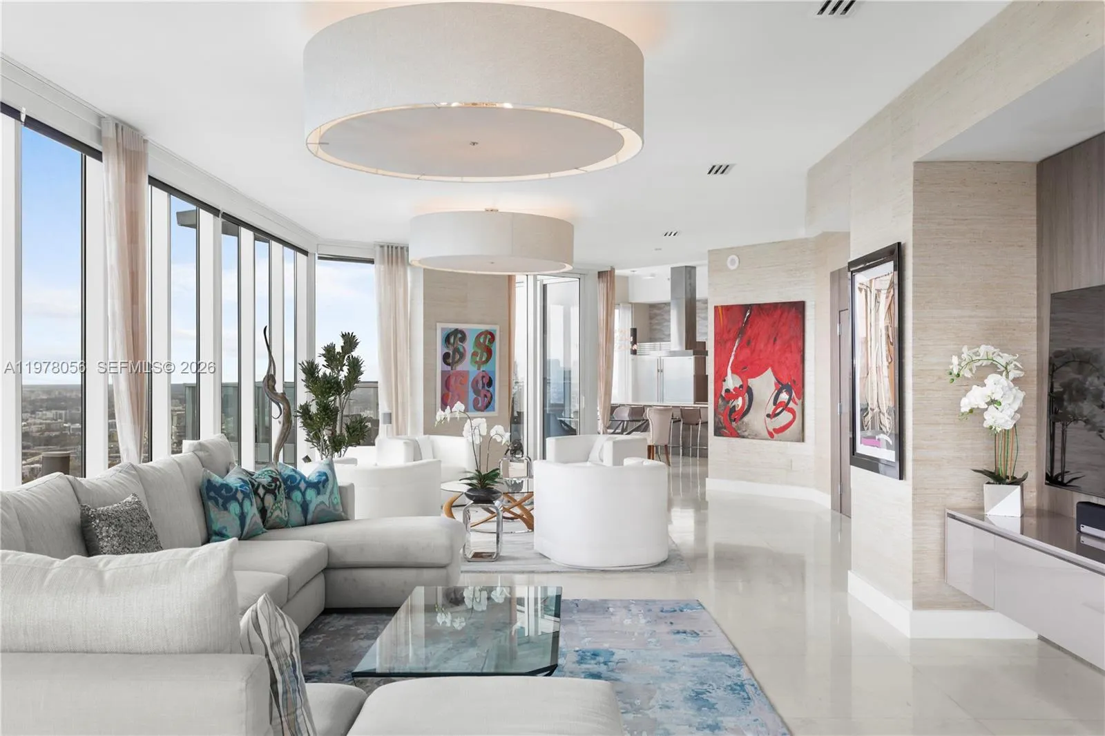 Living room with sweeping water and skyline views