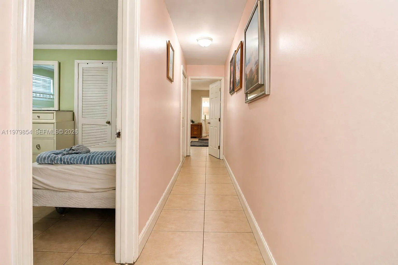 HALWAY THAT LEADS TO BEDTOOMS. THE DOOR WAY AT THE END IS THE MASTER BEDROOM