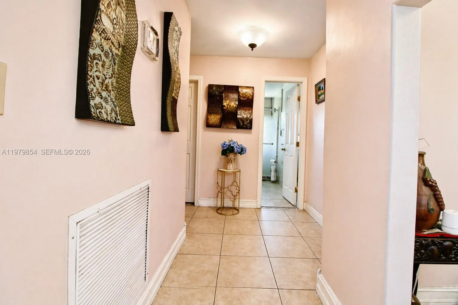 VIEW FROM HALL WAY TO SHARED BATHROOM