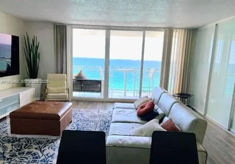 Living room with direct ocean terrace location views
