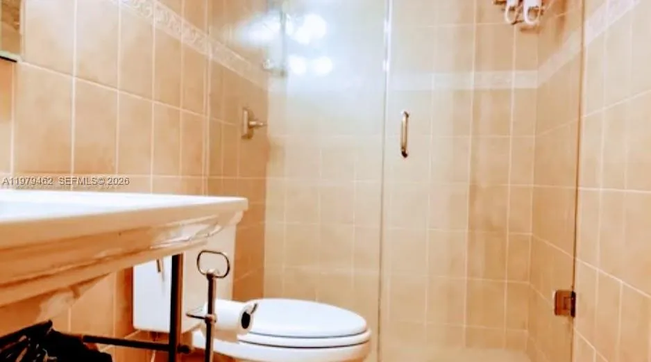 bathroom with walk-in shower glass encloser