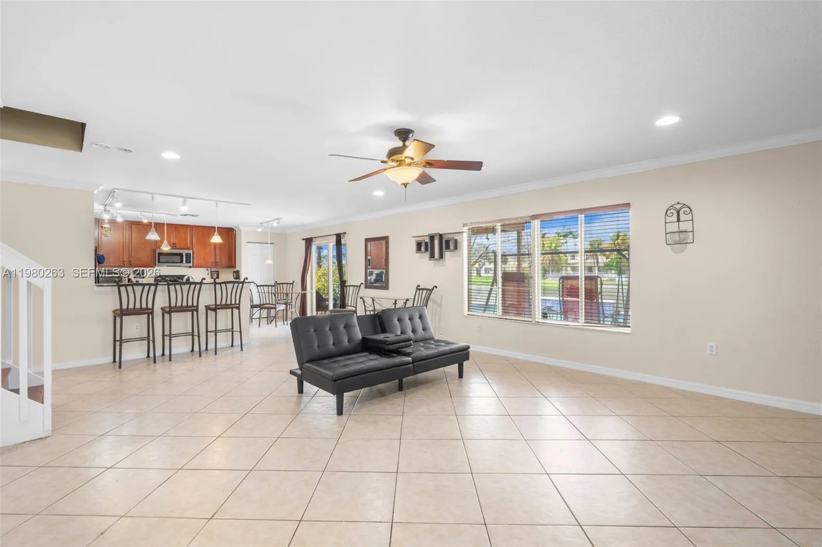 Big waterfront family room overlooking pool and water