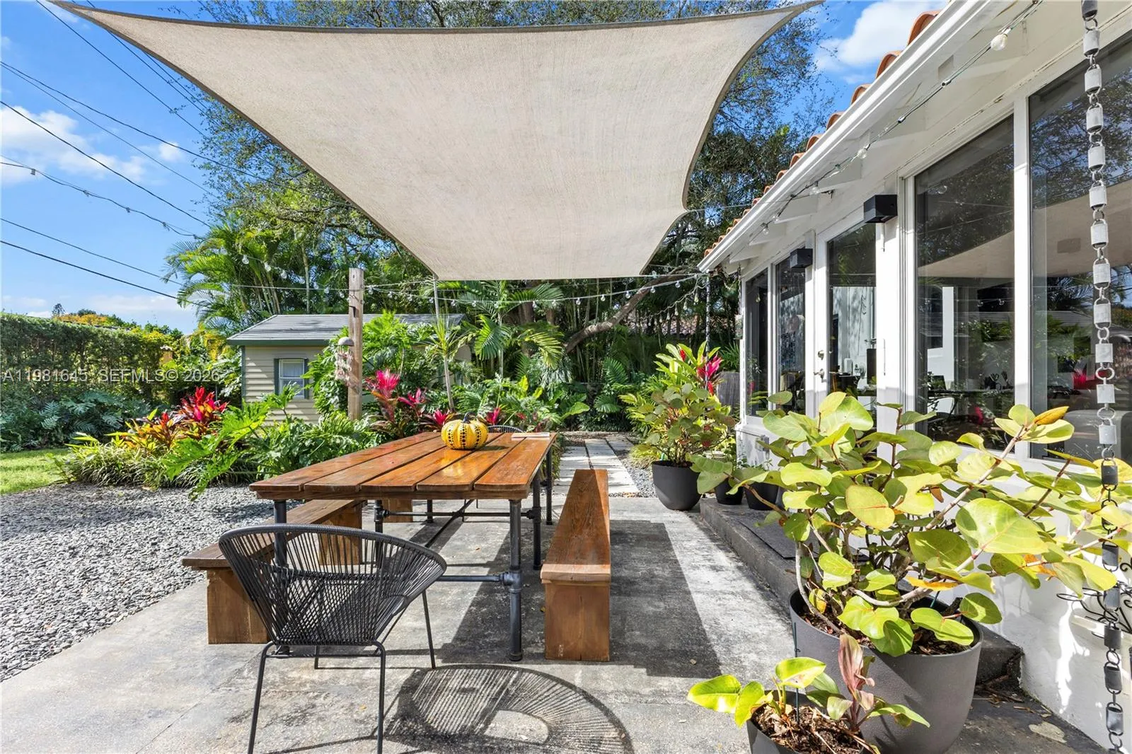 eautiful backyard with lush landscaping that feels like a private paradise, featuring BBQ areas and a Japanese outdoor cooking station—experience the true charm of Miami indoor-outdoor living