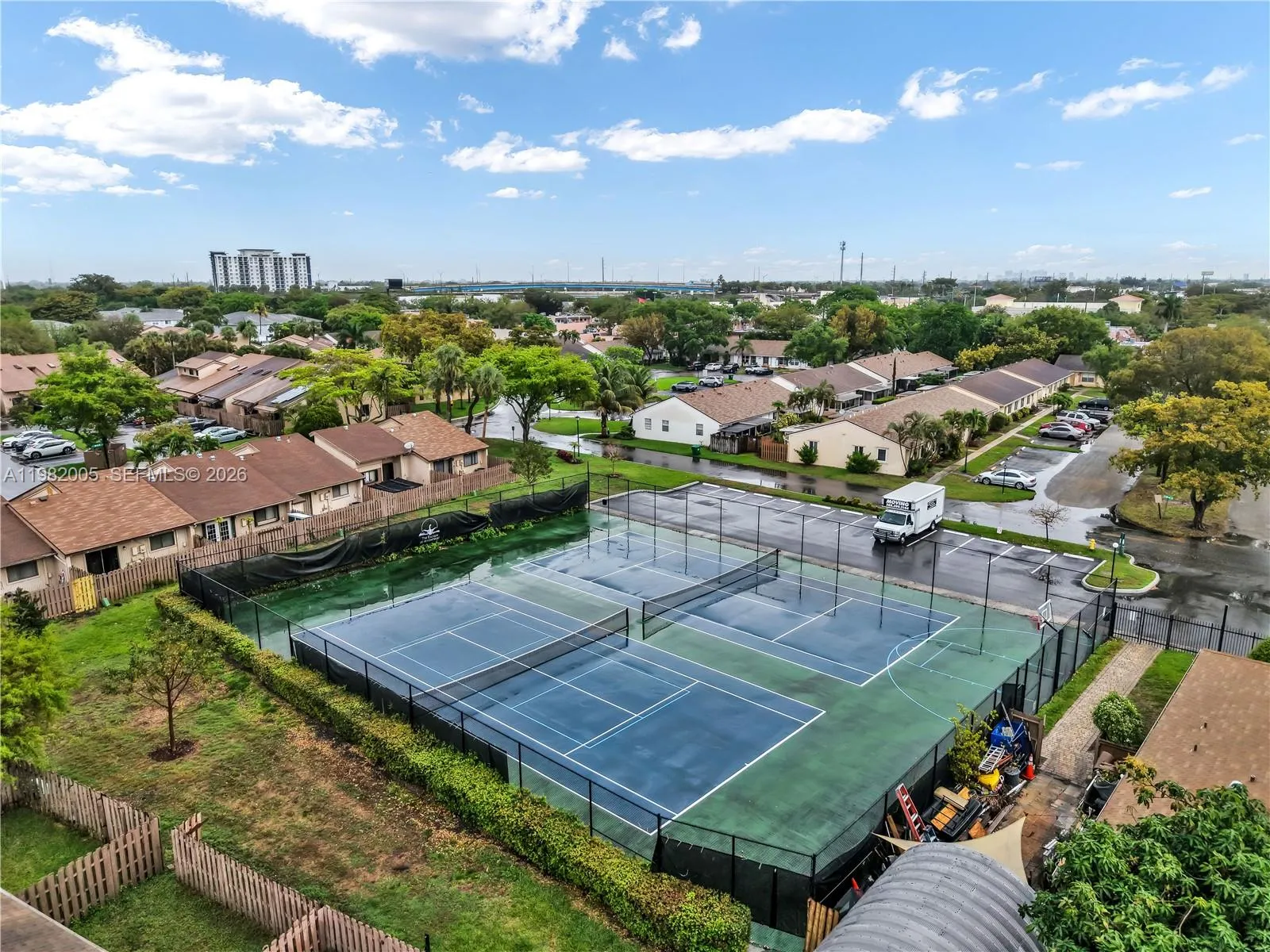 Aerial view of the community tennis and basketball courts.