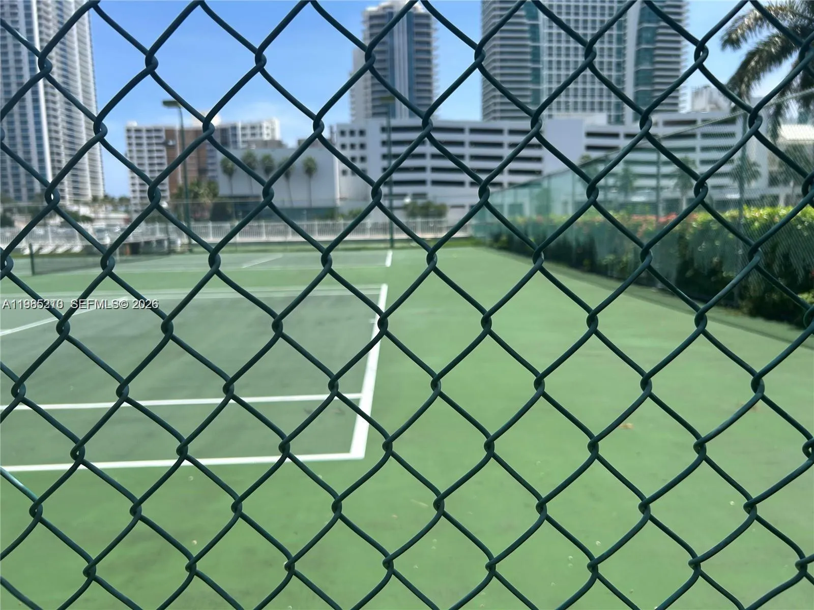 Tennis courts with lights at night.