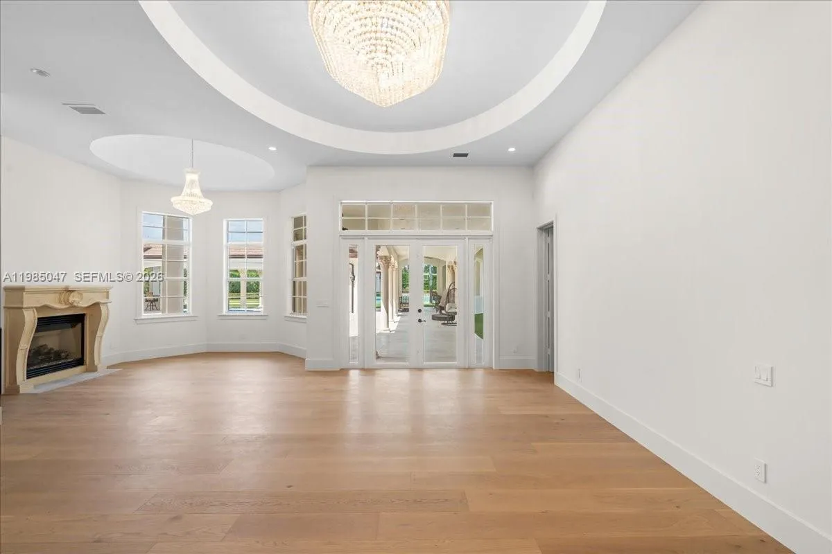 Primary sitting area with wet bar and fireplace