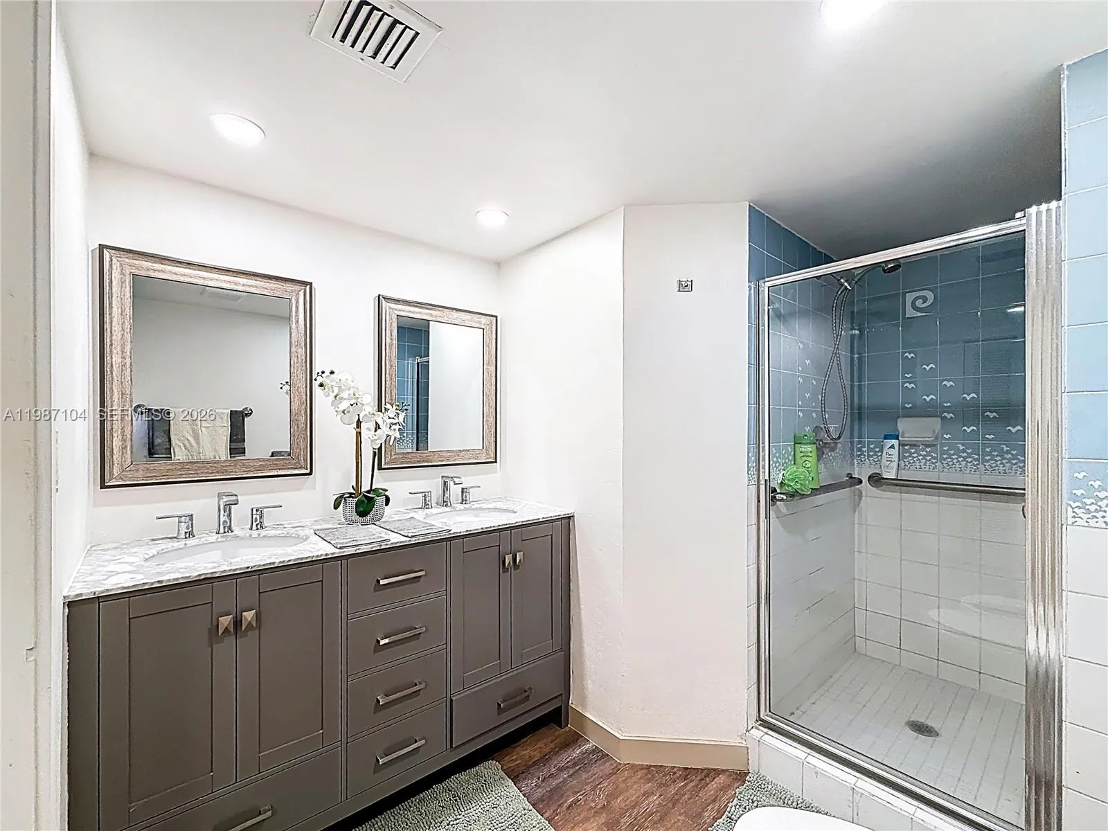 featuring double sinks, shower & bidet