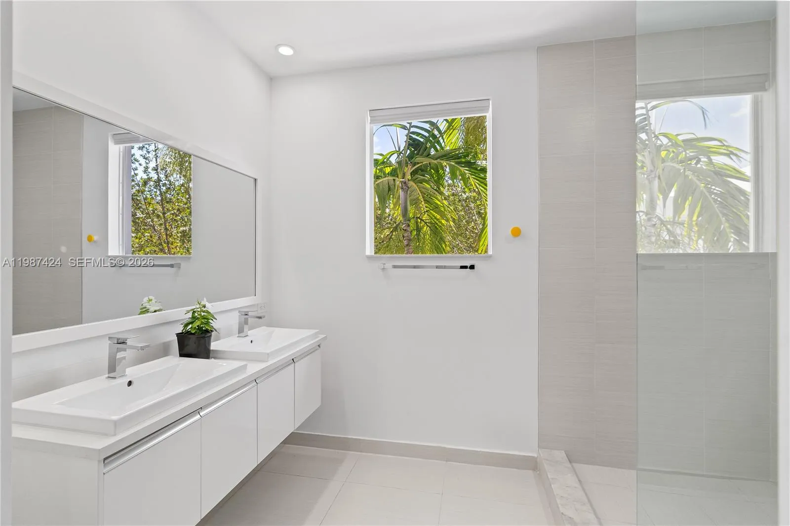 Ensuite bathroom with his and hers vanities - principal bathroom