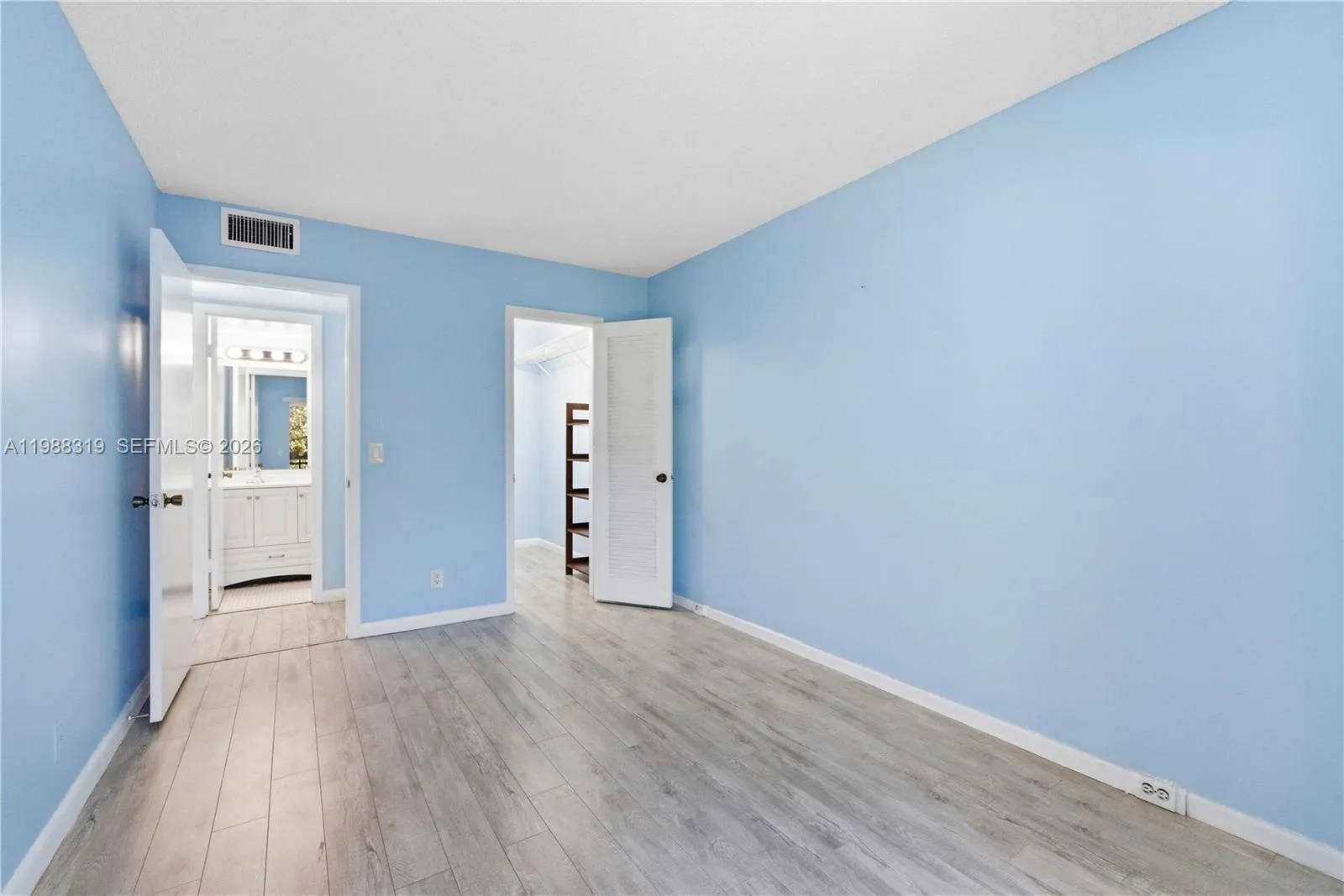 Primary bedroom with walk in closet