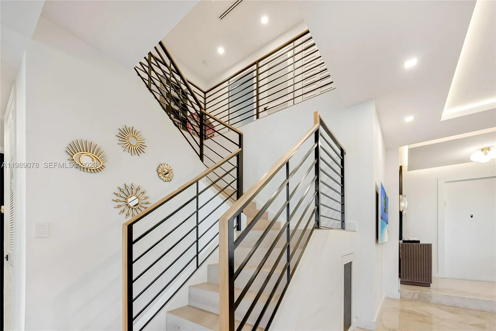 Updated Aventura Lakes home adorned with updated staircase railing for modern feel
