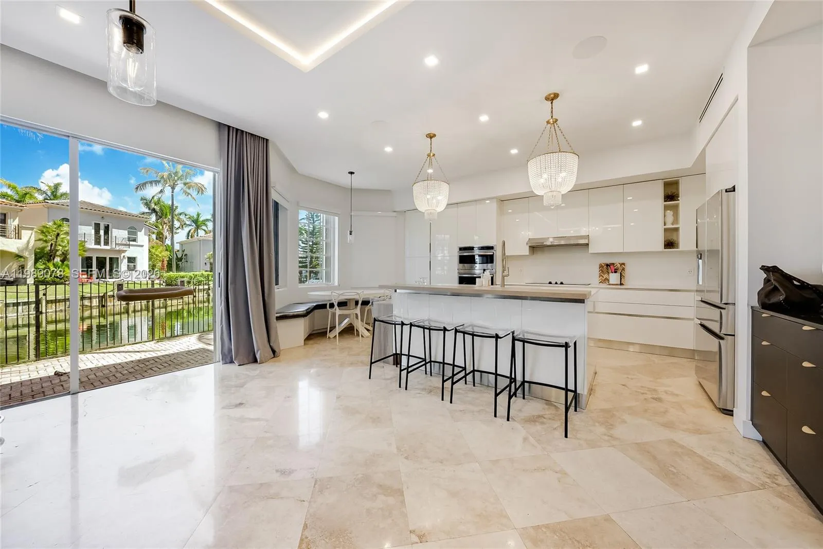 Modern kitchen with quartz counter tops in open concept Aventura Lakes