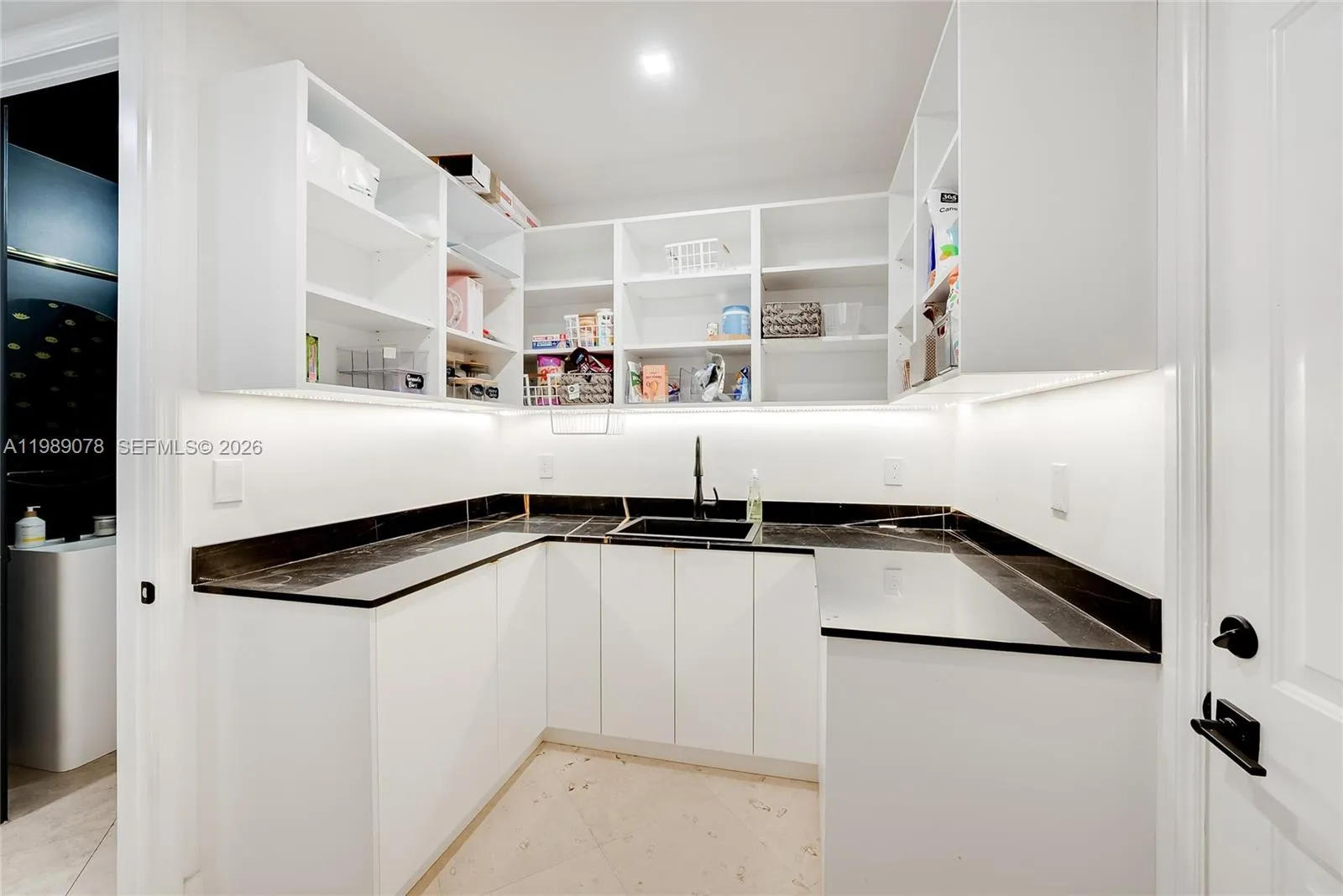 Butler\'s pantry off two car garage makes for great storage for your large family and easy access to car and home