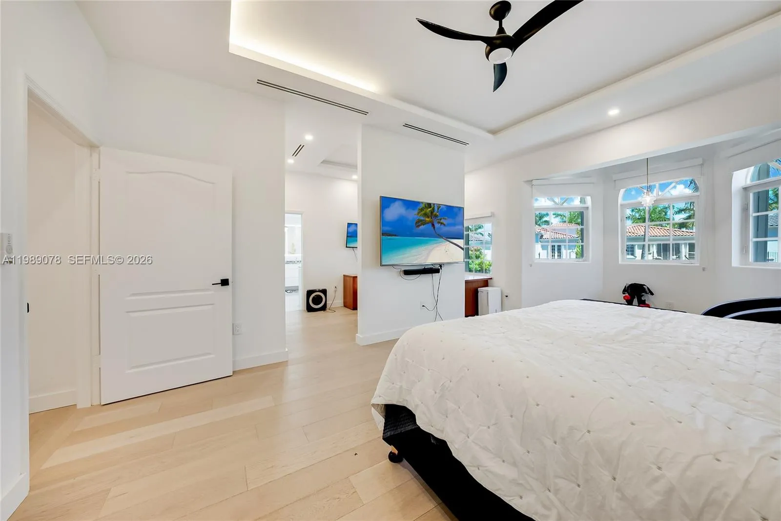 Creative, modern partition in primary suite give separation to office space or dressing area