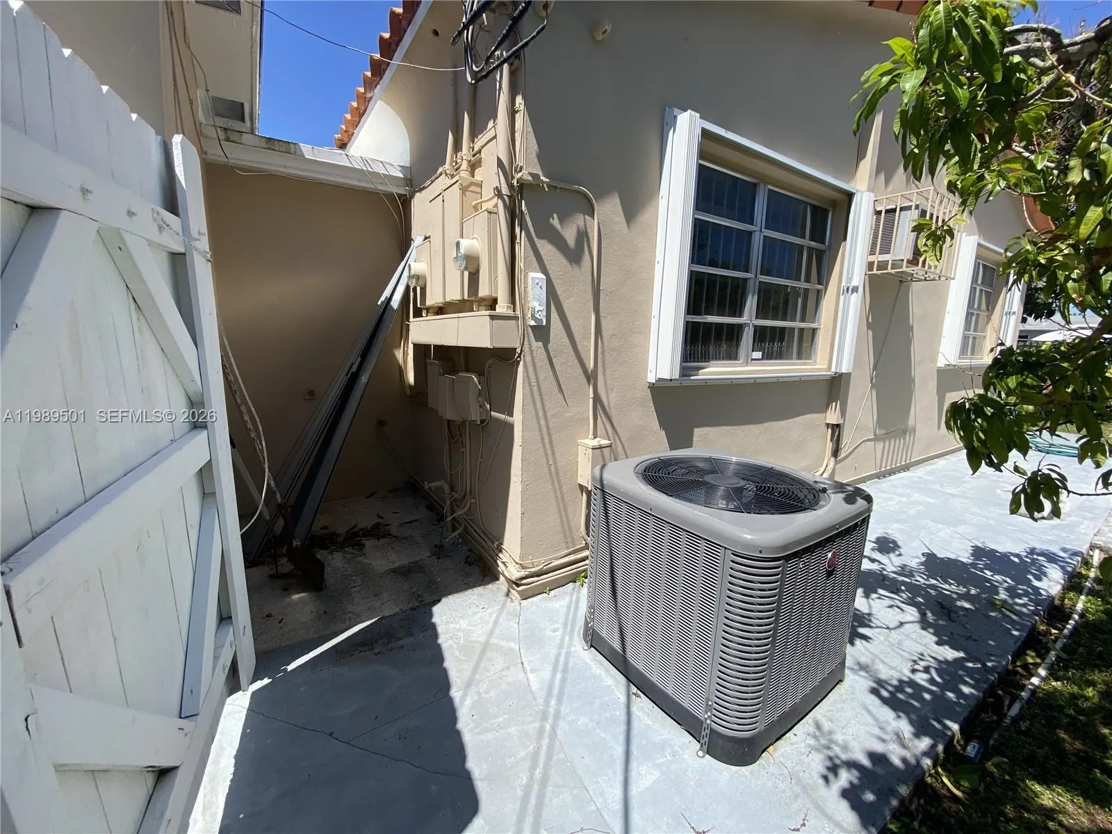 View of meter room and A/C condenser unit.