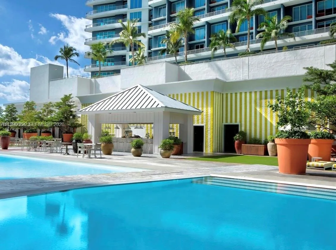 Mid floor pool and bar for residents and Hotel