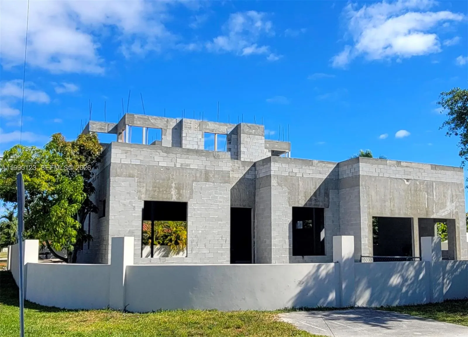 Entire home in true CBS construction, BUNKER FORM—solid reinforced concrete block exterior walls, which include poured tie-beams/columns and a reinforced concrete roof, creating a continuous concrete structure. RESULT: premium, hurricane-ready construction.