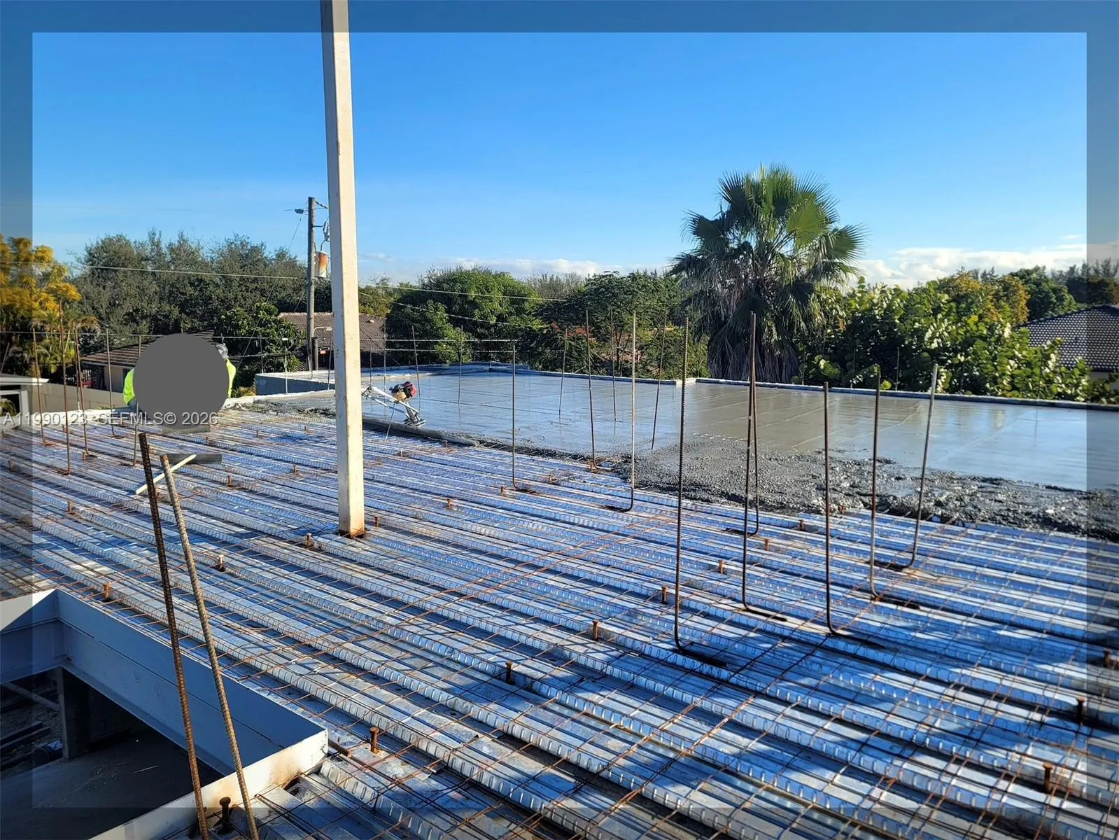 A TRUE MODERN BUNKER HOME- You are observing the roof slab concrete pouring, leveling and steel rebars installed on the flat reinforced concrete roof. RESULT: A house engineered to withstand hurricanes, tornadoes and other natural disasters. Flat reinforced concrete roofs last 50+ years with little maintenance.