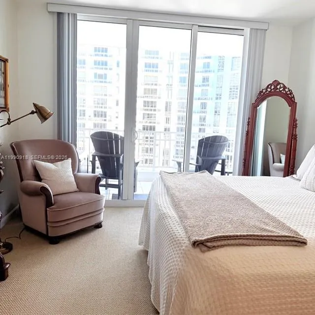 Master bedroom with private balcony view.