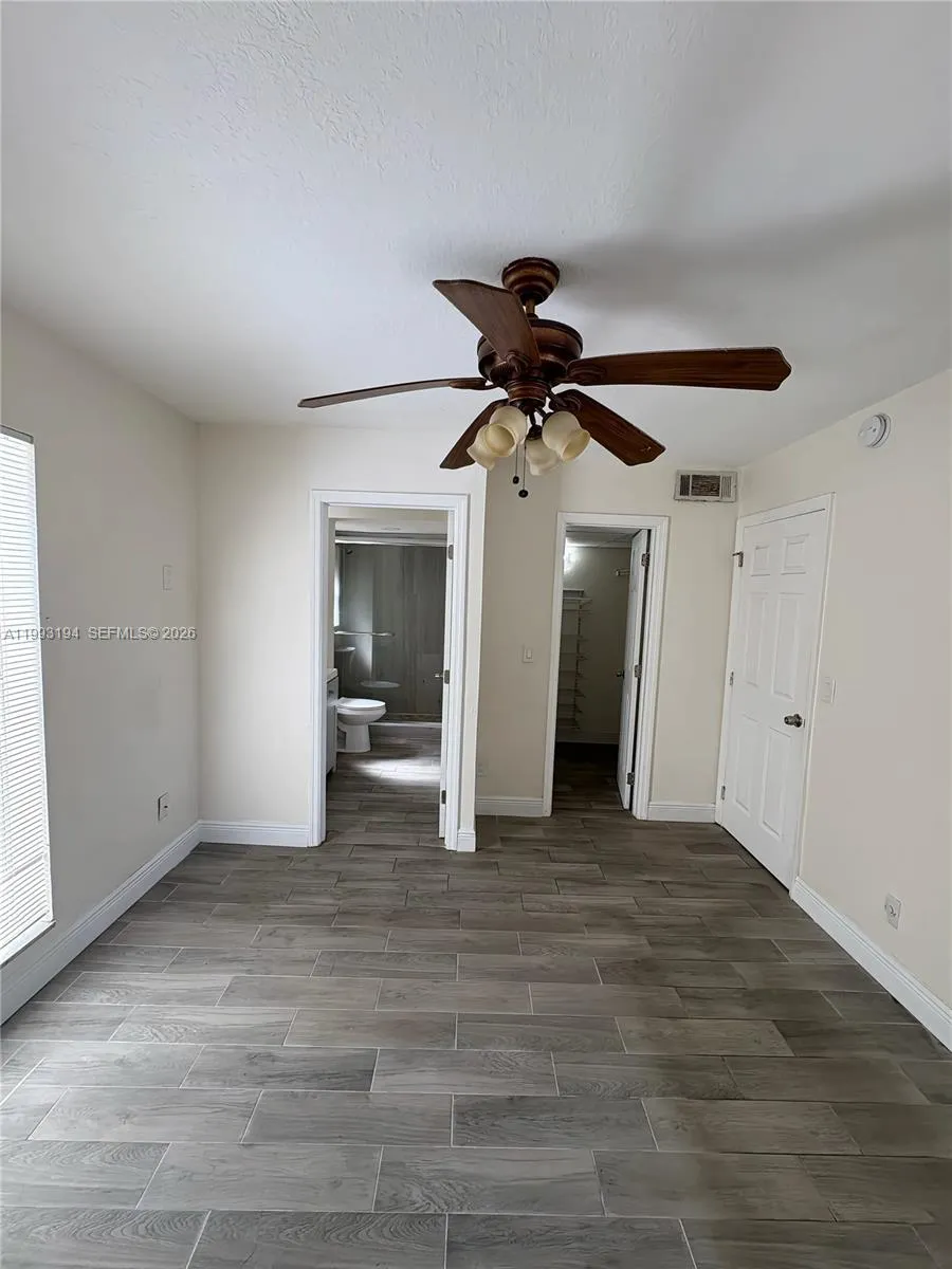 Primary bedroom with ensuite bath and closet