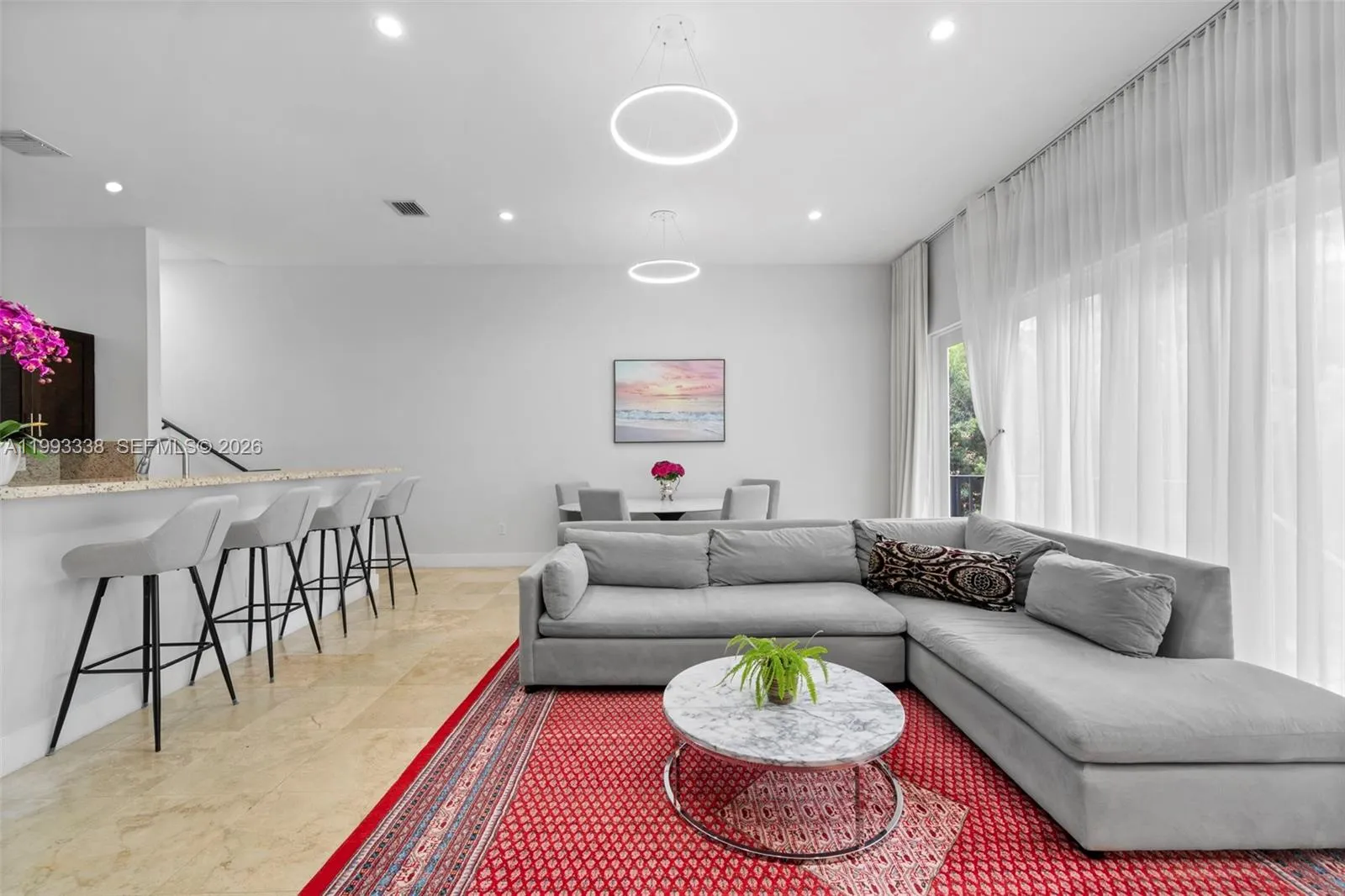 11-ft ceilings & floor-to-ceiling windows.