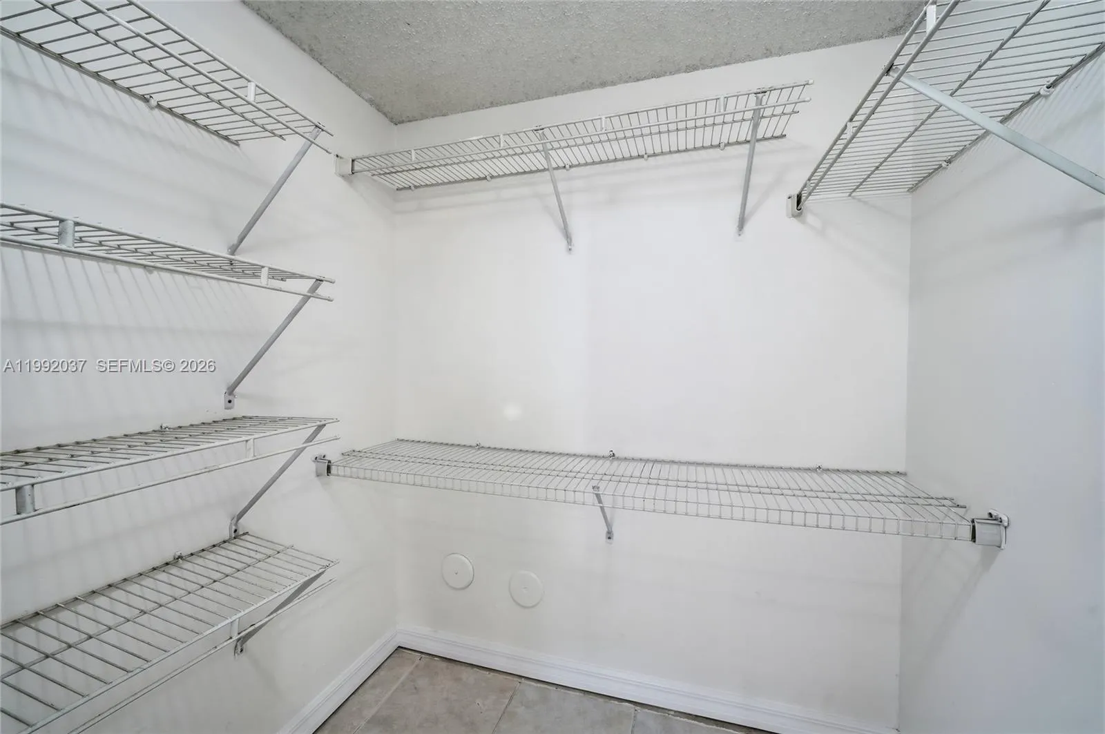 Large walk-in closet with built in shelving