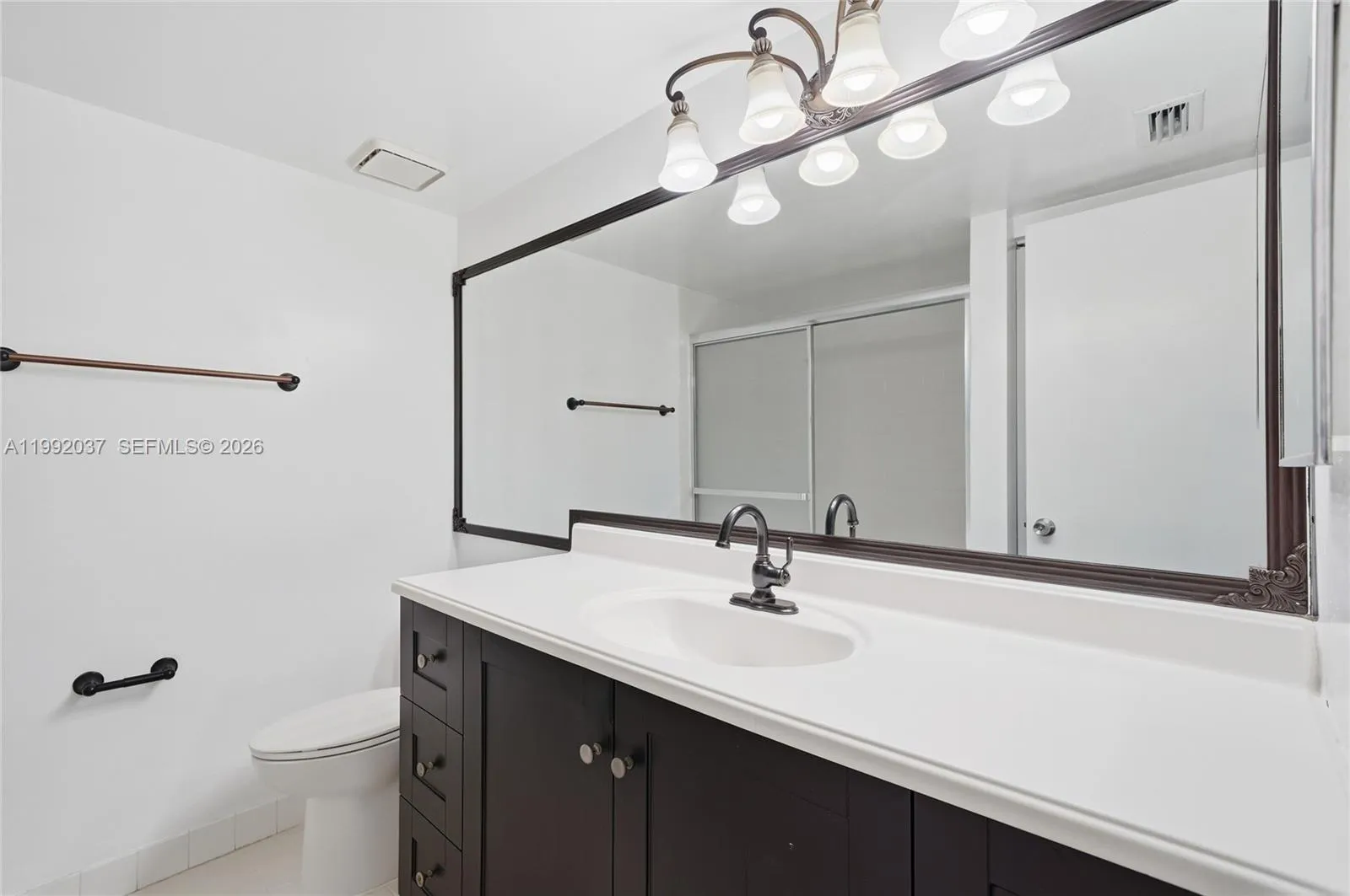 Beautiful, updated bathroom, modern vanity and mirror