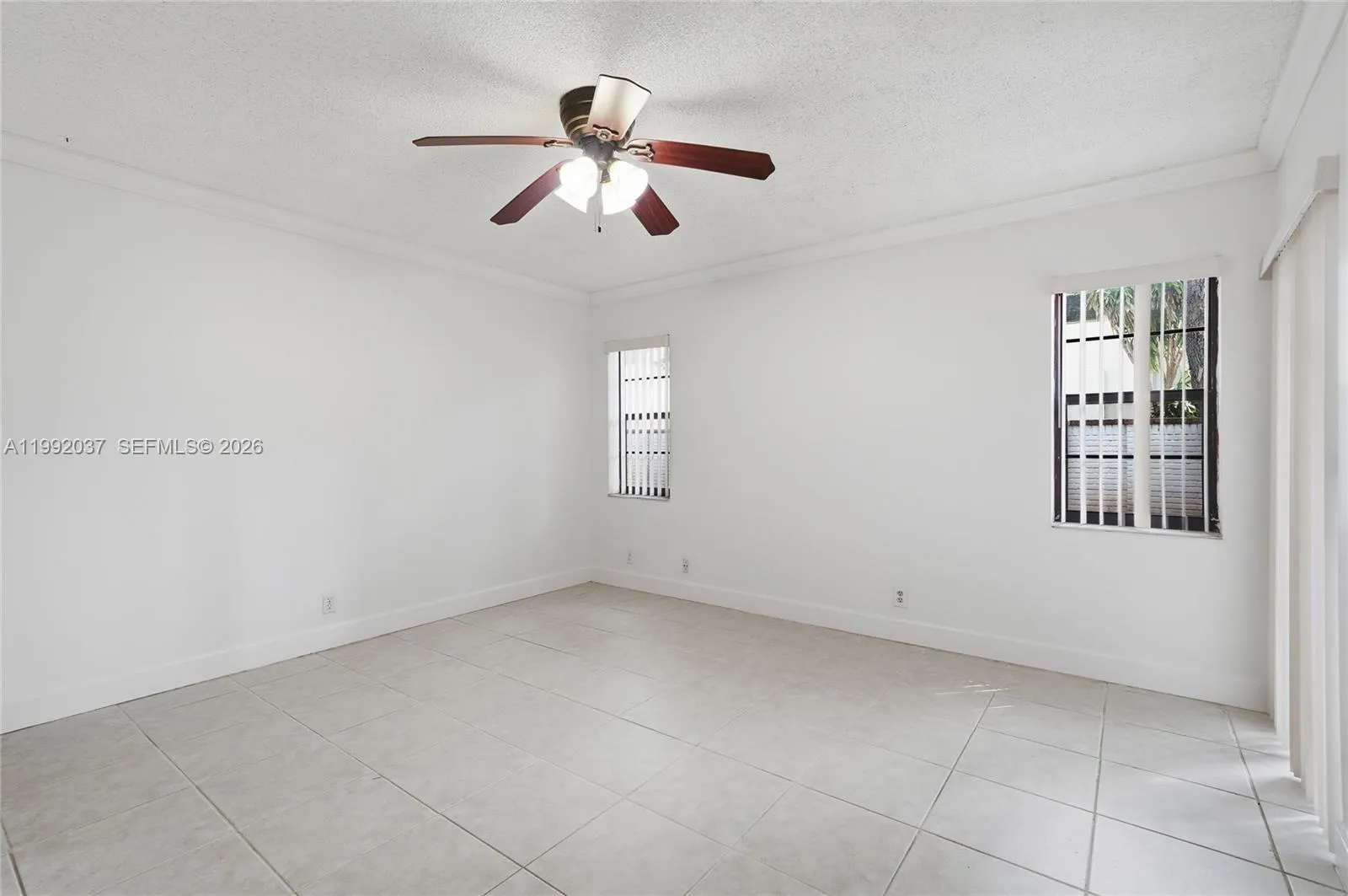 Spacious bedroom with ceiling fan