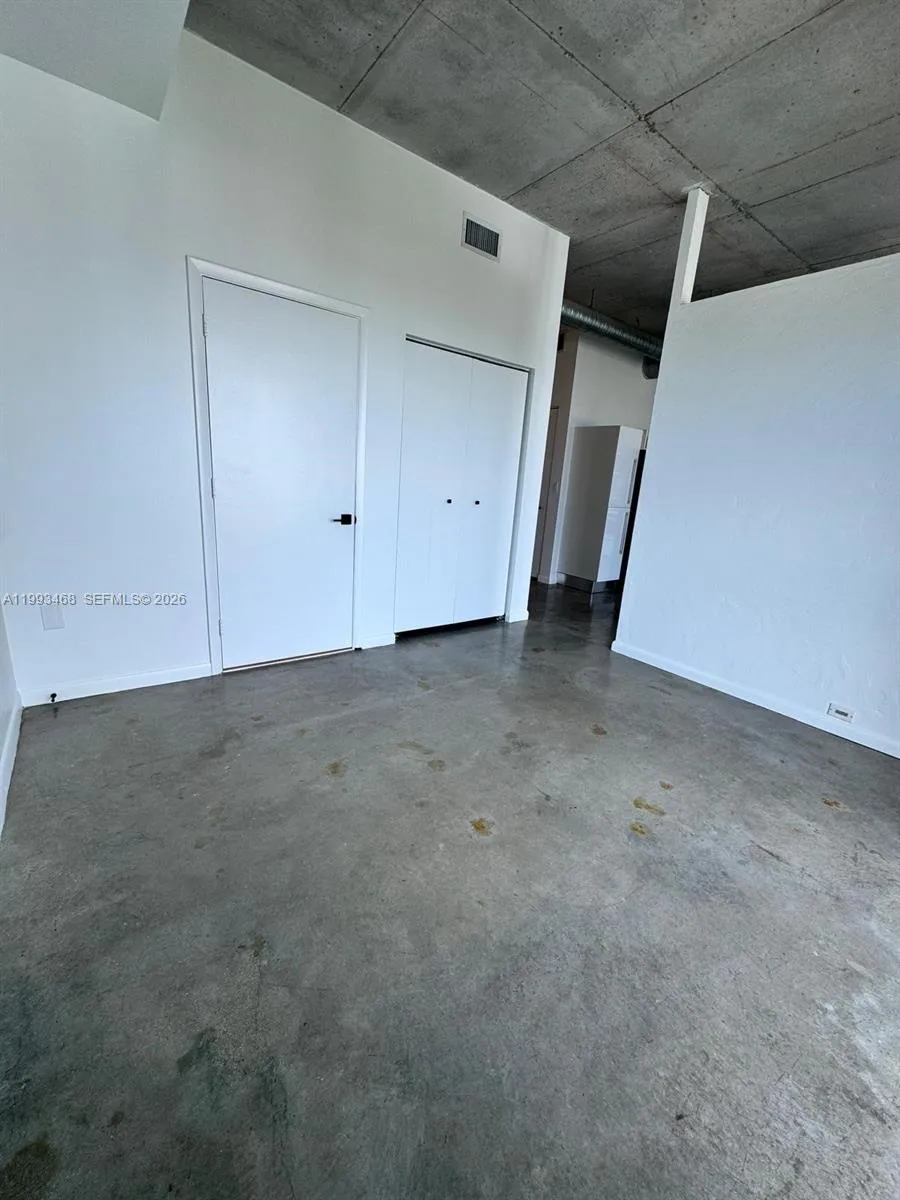 View from the left corner facing the bedroom, from the entry seen in the photo