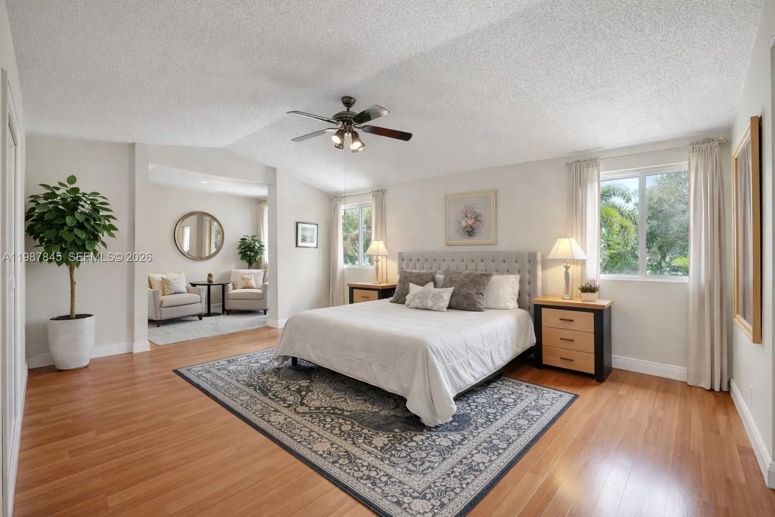 DIGITALLY STAGED Primary Bedroom and Sitting Area