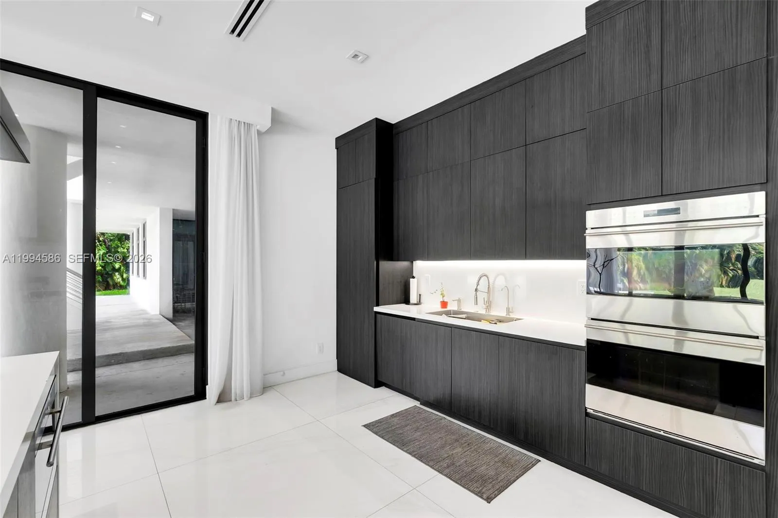 Seamless kitchen cabinetry and pantry door