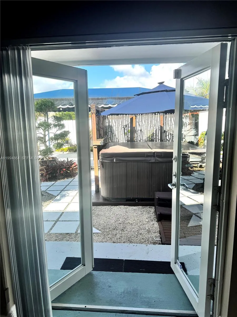 French doors opening up to backyard