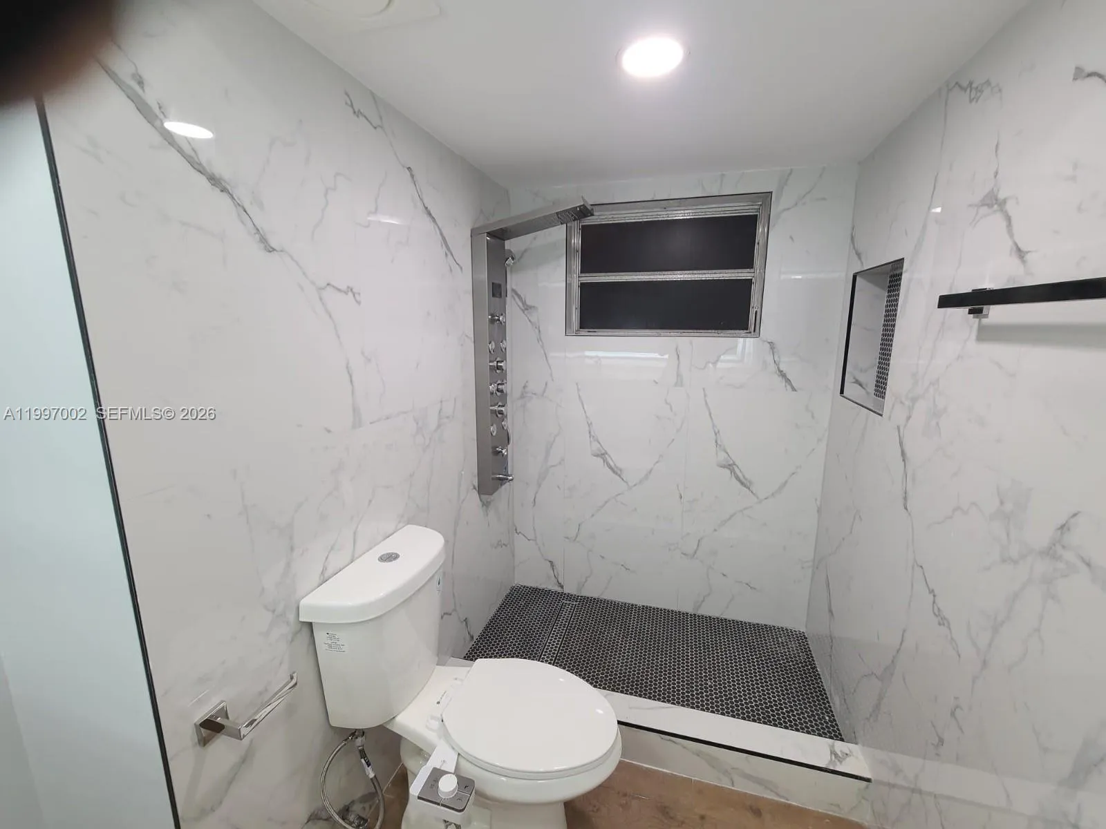 Master bathroom with shower.