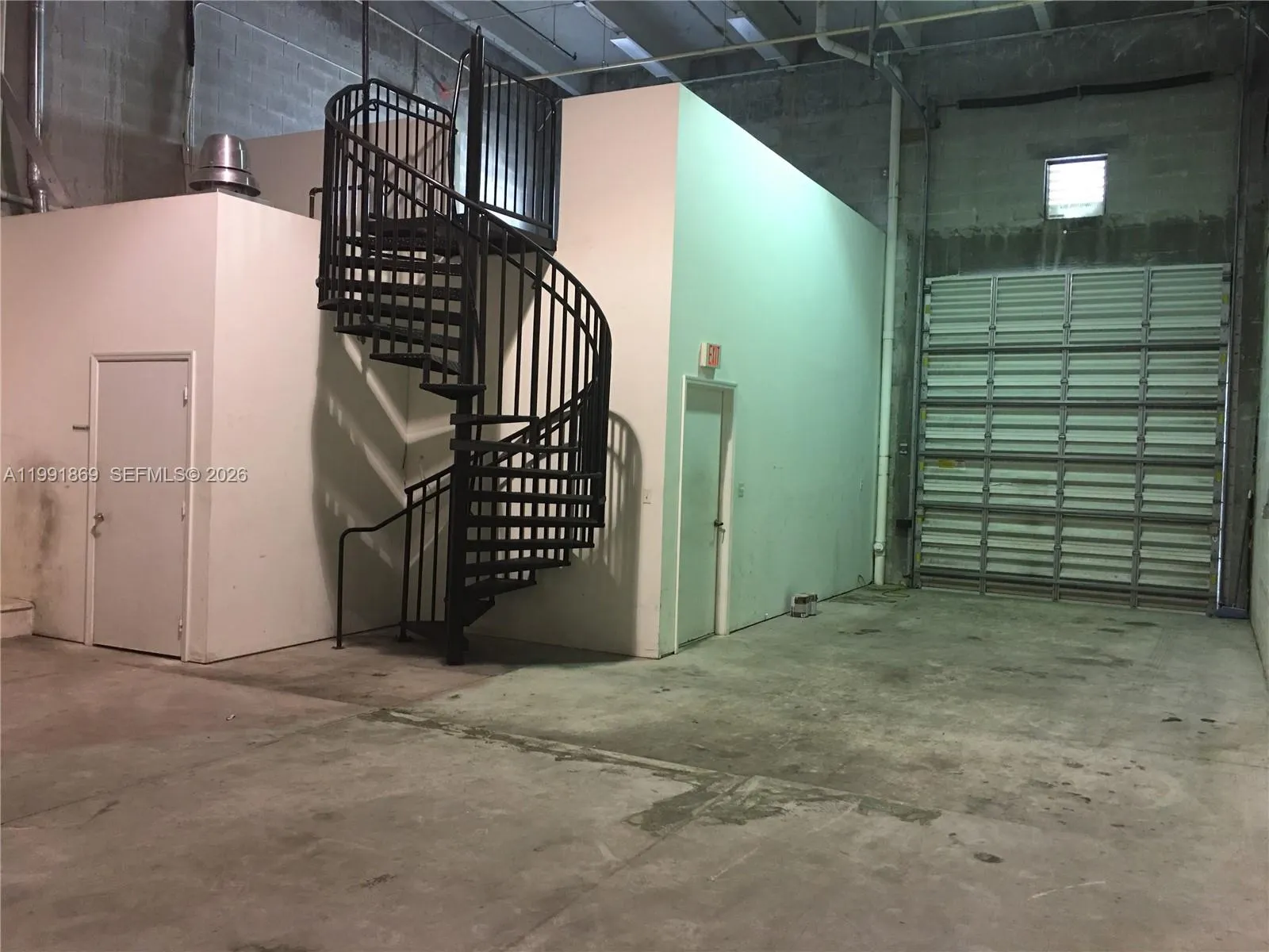 Overhead door and stairs to the mezzanine