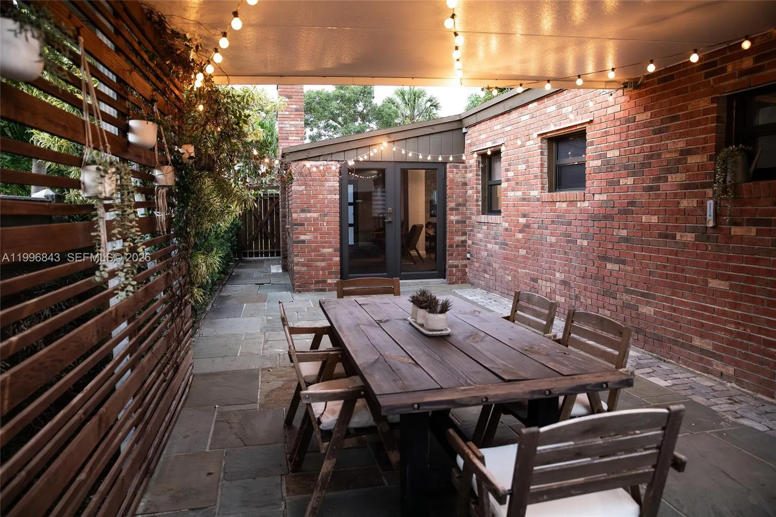 “Enjoy a large private backyard with a covered terrace — the perfect setting for relaxing evenings and weekend gatherings.”