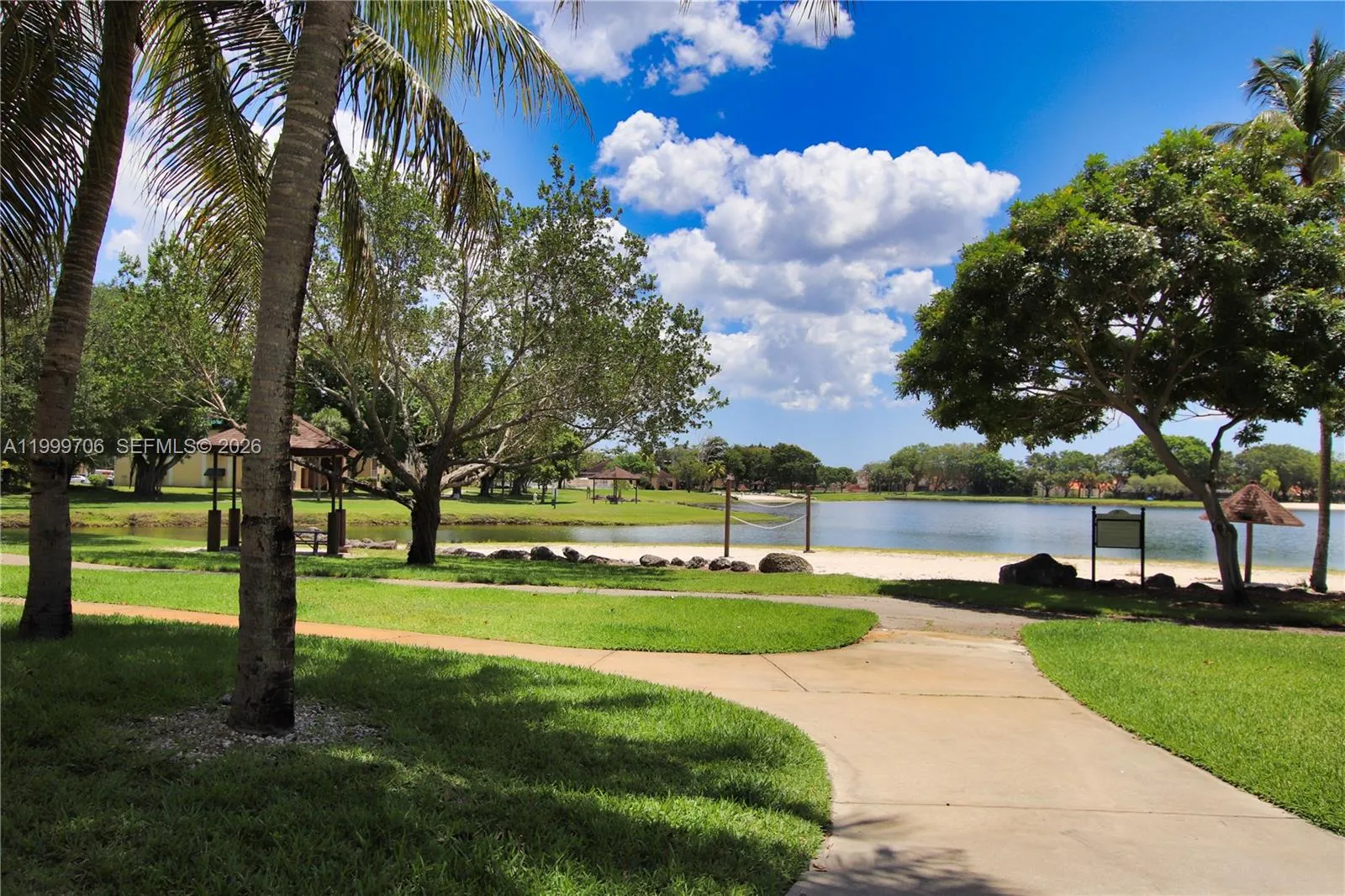lake and green belt behind the community