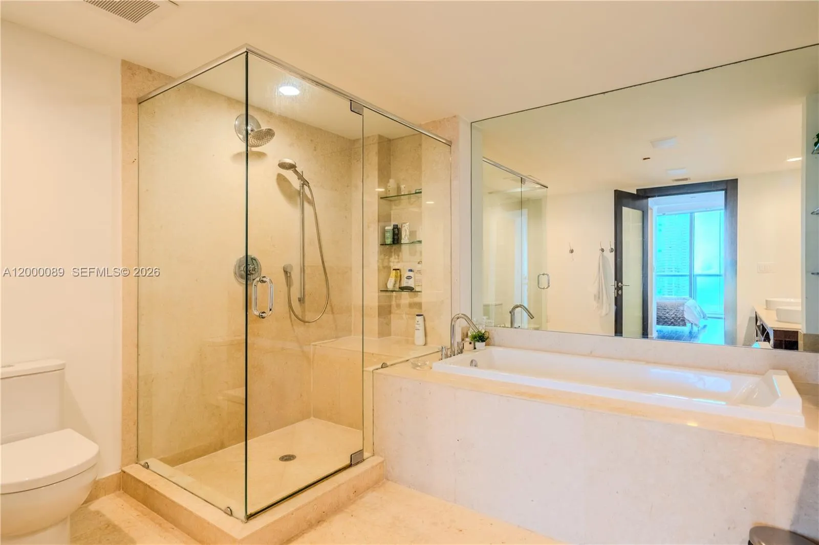 Master Suite bath with a separate standing shower and tub, 2 sinks.