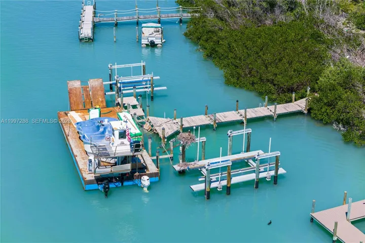 Deep water access and large enough to land a large barge - the property had two large boatlifts and easy access for additional boat parking!