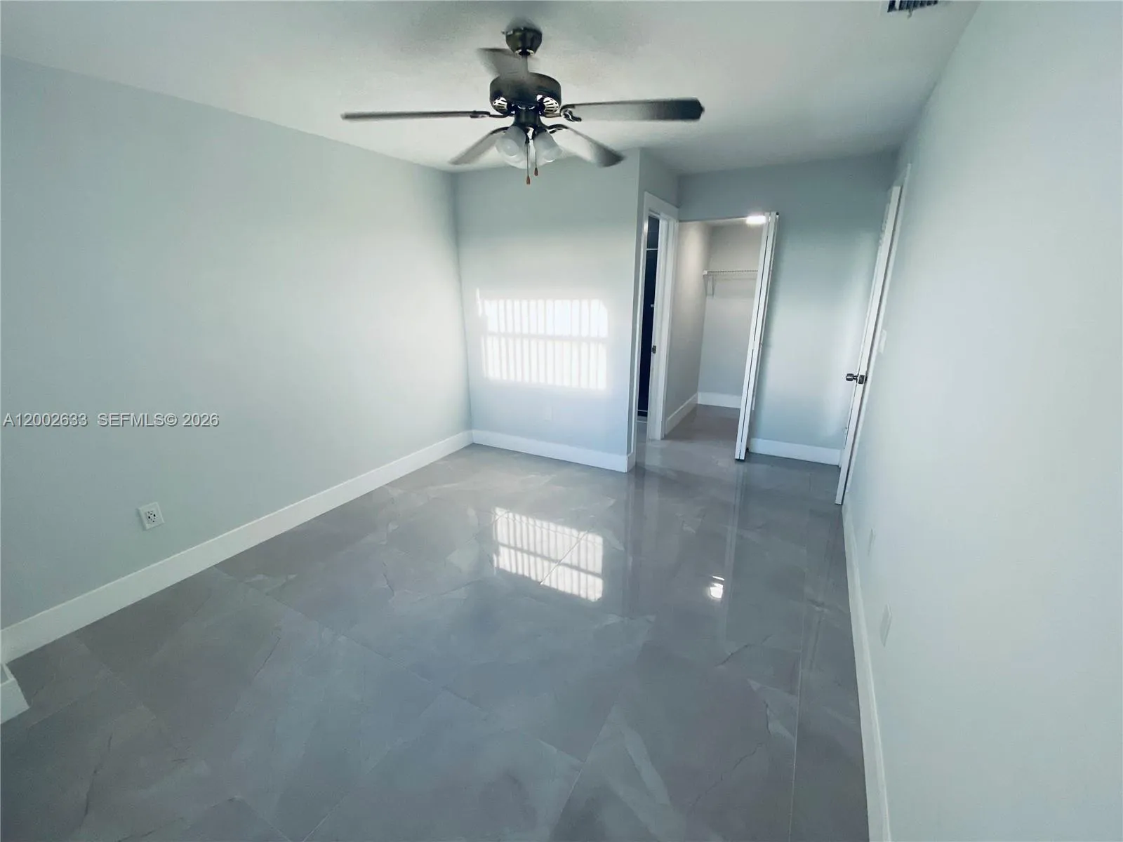 Master bedroom with walk in closet and en suite bathroom