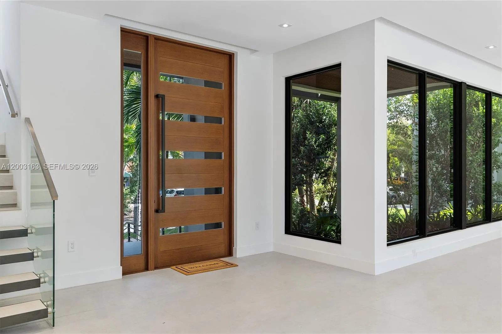 Foyer and ample luminous living/dining area