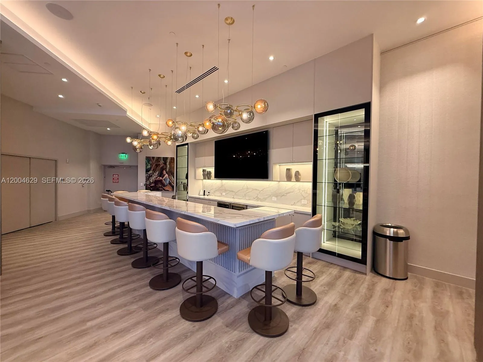 Indulge in the beauty of the wine bar, featuring an extensive selection and sophisticated design—perfect for entertaining or unwinding.\n