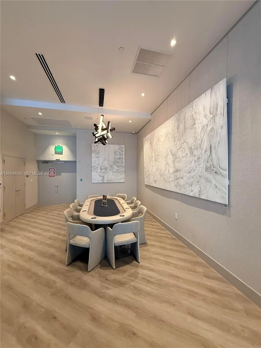 Enjoy dedicated gaming in the elegant card room, featuring custom furnishings and a sophisticated ambiance, perfect for hosting friends or enjoying a quiet game night.