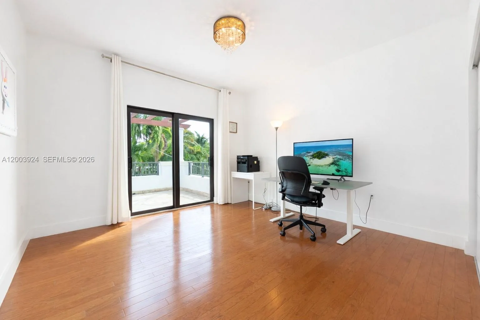 second floor bedroom with ensuite bathroom faces back yard and connects to large second floor terrace via floor-to-ceiling glass door. Large built in closets.