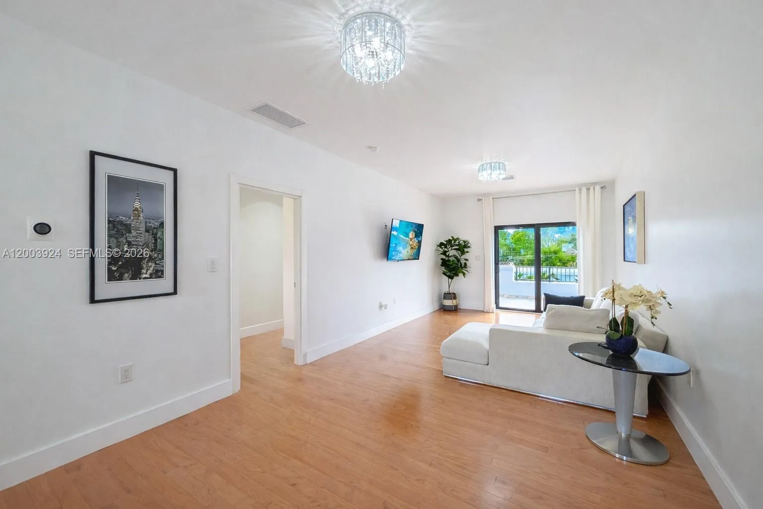 oversized landing and recreation area leading to second floor terrace overlooking back yard.