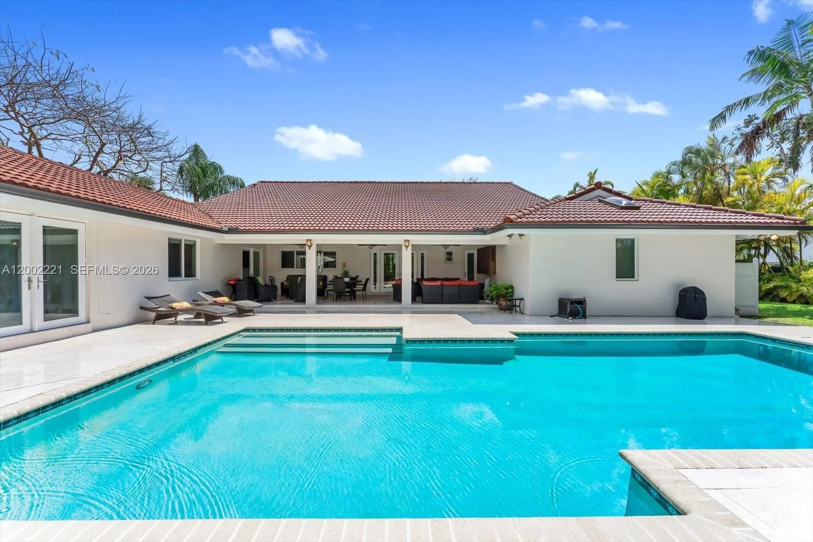 Another view of the pool & covered patio