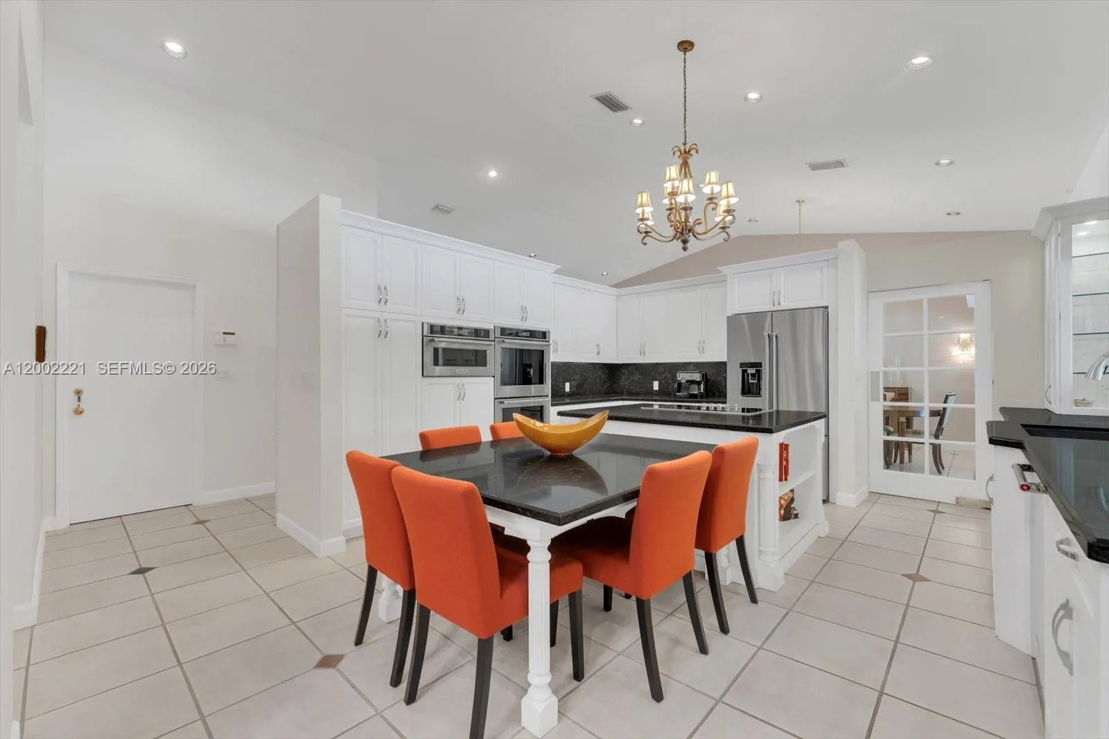 Updated Kitchen with a cooking island, double ovens, KitchenAid appliances