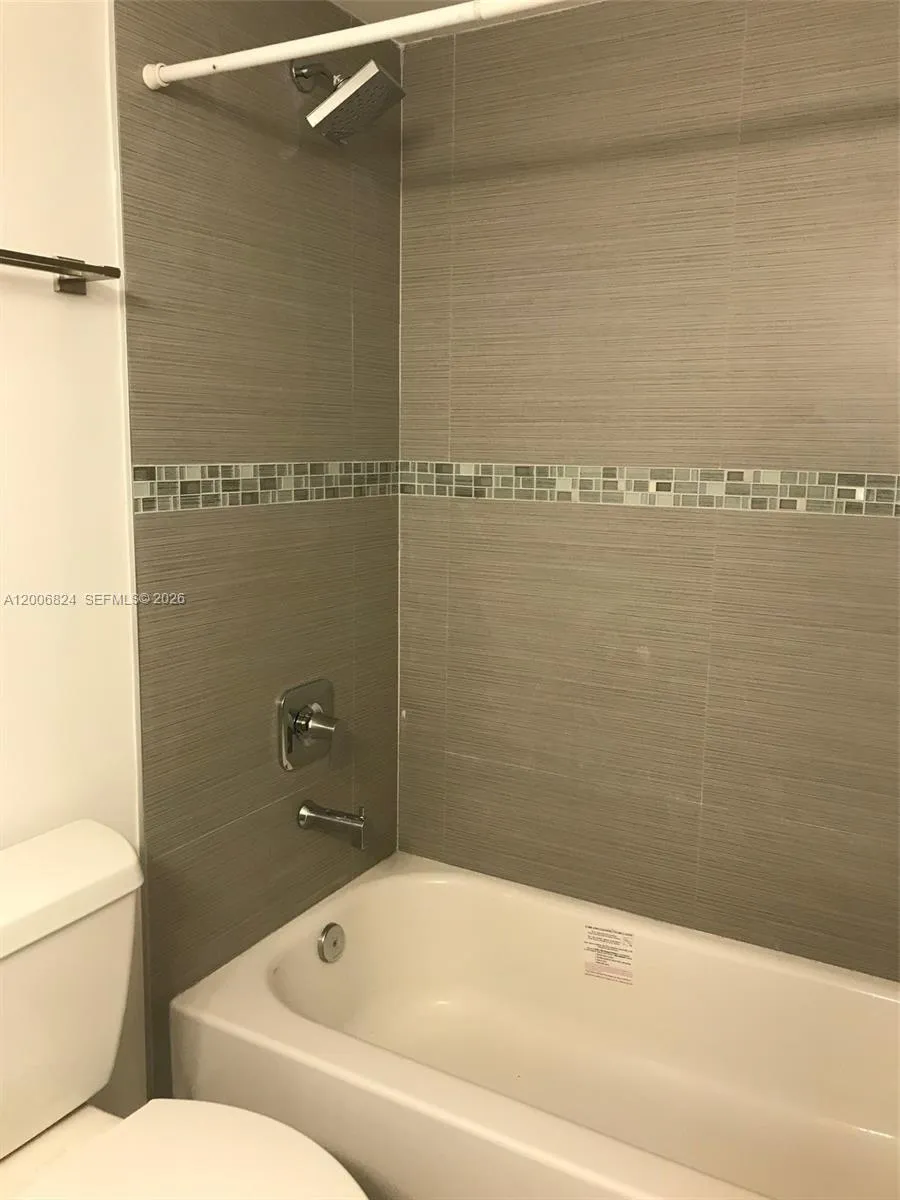 Full Bathroom with Nicely Tiled Shower & Tub