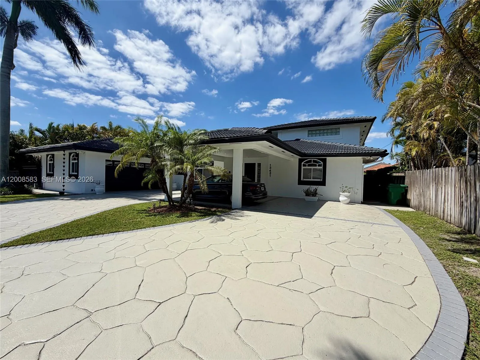 Right side of driveway and home