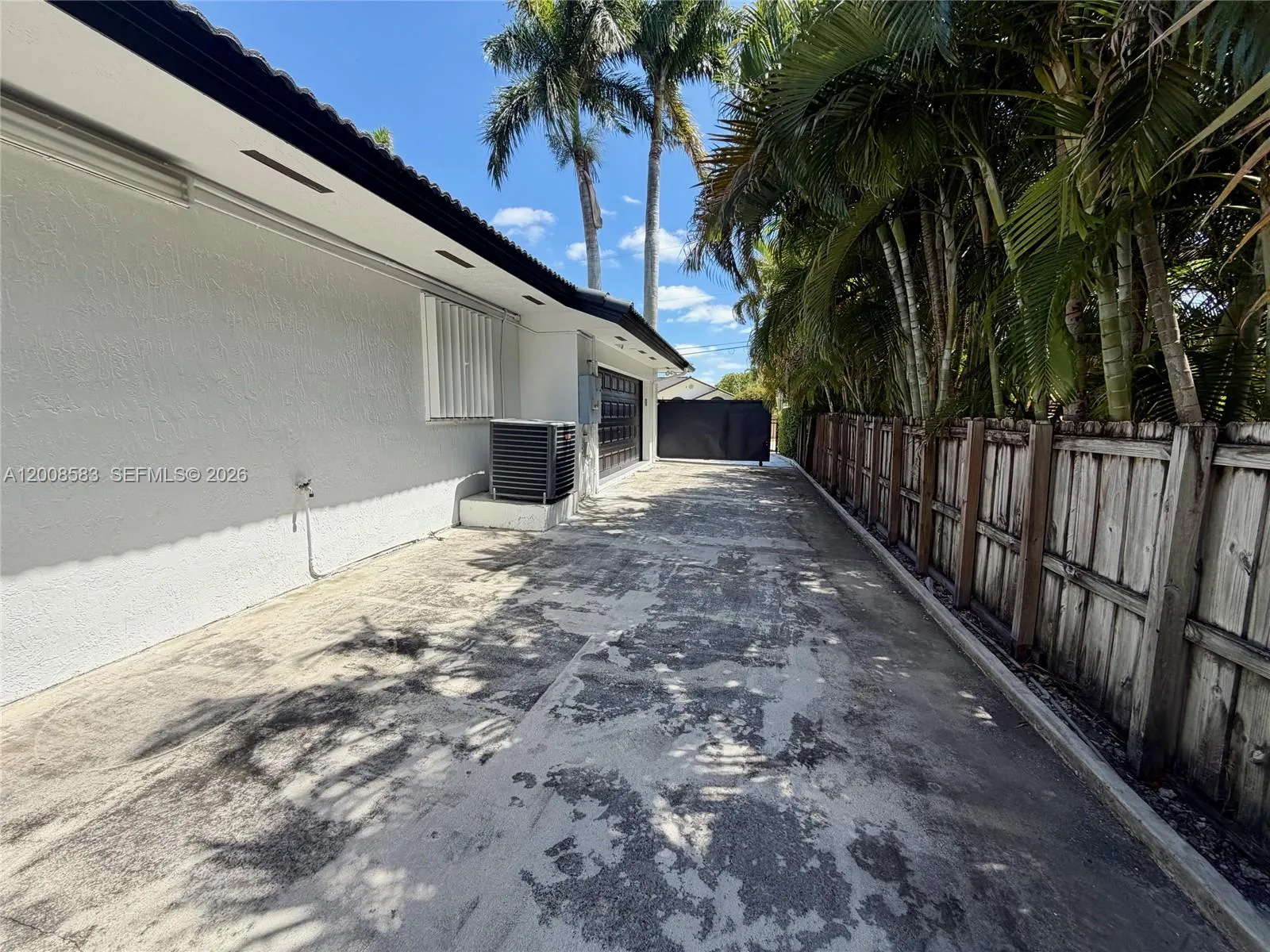 Side driveway to back garages